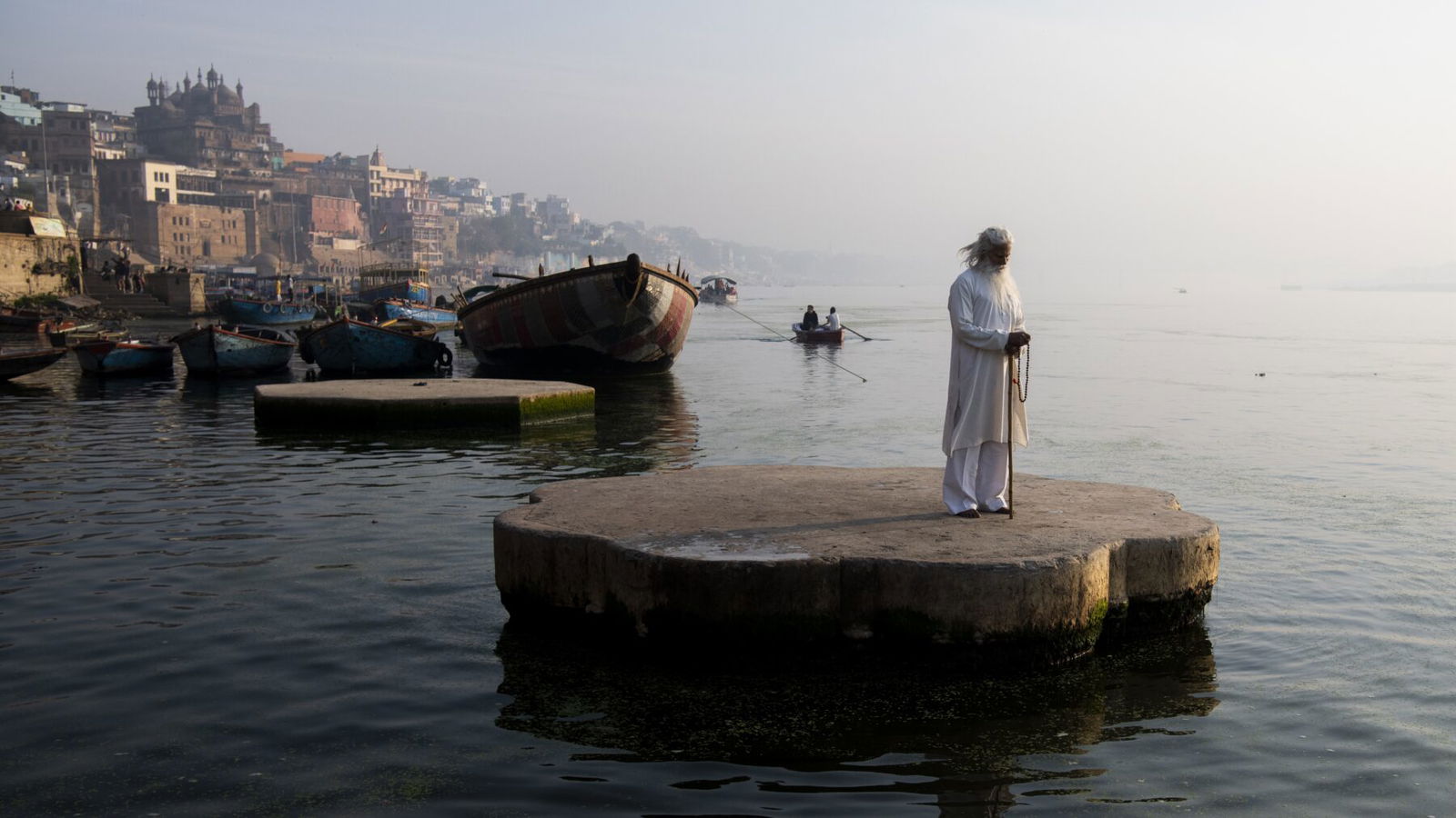 color travel portrait landscape photo of sadhu man in Varanasi, India by Mo Kamal