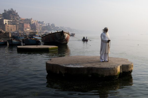 color travel portrait landscape photo of sadhu man in Varanasi, India by Mo Kamal