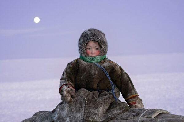 color portrait and landscape photo of young nenet child, Yamal peninsula, Siberia, Northern Russia by Nicola Ducati