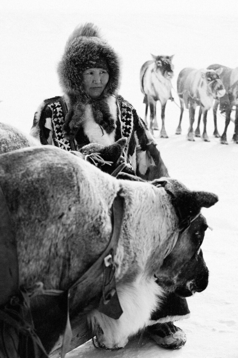 black and white portrait photo of woman with reindeer in Yamal Peninsula, Russia by Kate Surzhok